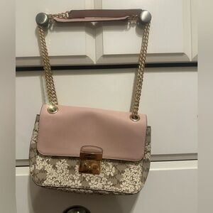 Michael Kors blush and floral purse.